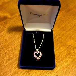 Ruby and diamond heart pendant with gold chain